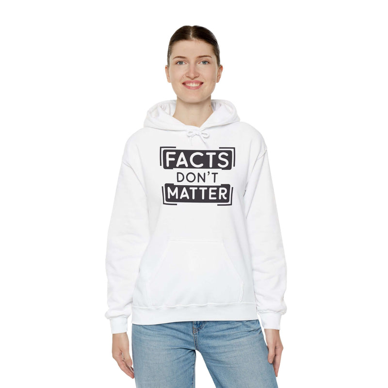 Woman wearing white 'Facts Don't Matter' graphic hoodie, ideal for casual wear and colder days.