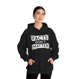 Woman wearing black 'Facts Don't Matter' graphic hoodie with spacious kangaroo pocket, perfect for casual, stylish comfort.