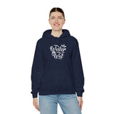 Woman wearing a navy blue 'Water Is Wet' graphic hoodie, perfect for stylish casual wear and cozy days.