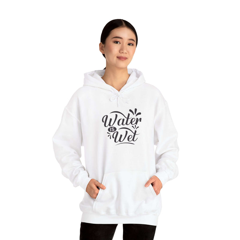 Stylish white women's hoodie with 'Water Is Wet' graphic and spacious kangaroo pouch for casual wear.