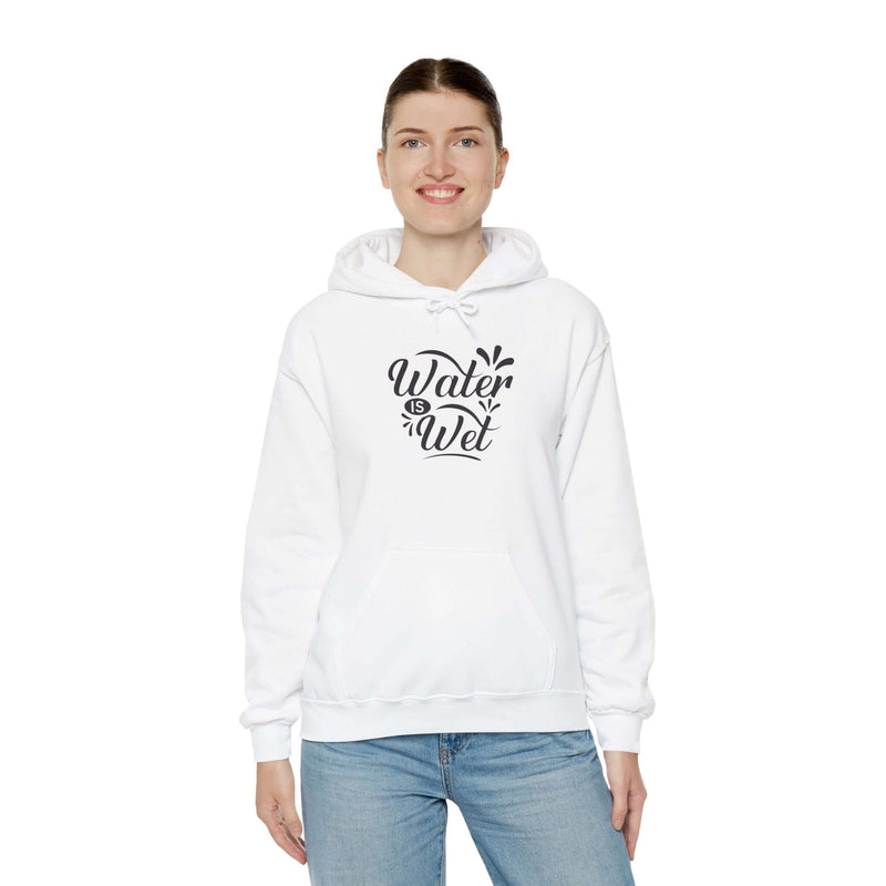 Woman wearing a white hoodie featuring 'Water Is Wet' graphic, perfect for casual style and comfort.