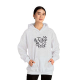 Woman wearing a gray 'Water Is Wet' graphic hoodie, perfect for casual and cozy styles.